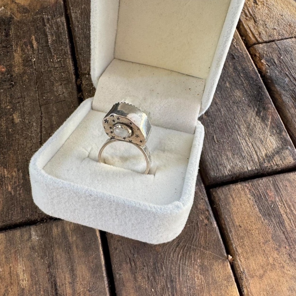Crystal with opal ring